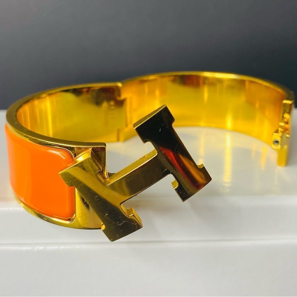 HERMES Signature Orange Enamel and Gold Plated Clic-Clac H GM Wide Bracelet